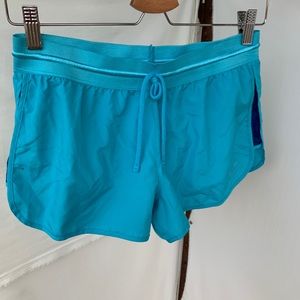 Blue Nike running shorts